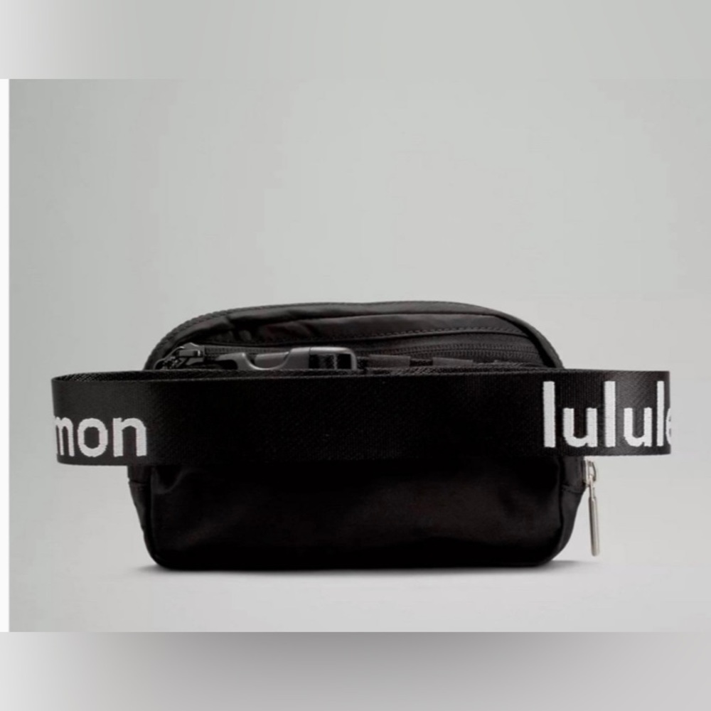 *sold on merc* Lululemon black everywhere belt bag with logo strap